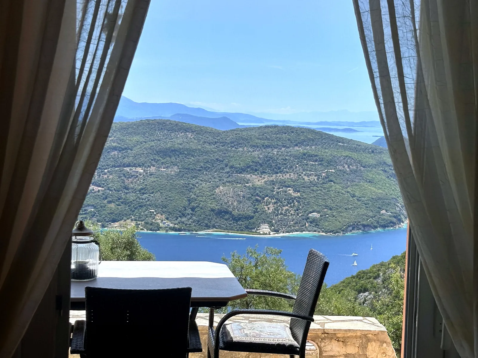 Through the living-room doors to the terrace and the sea
