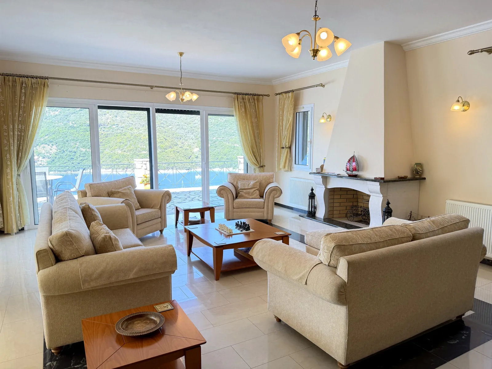 Living room with fireplace and windows on 3 sides