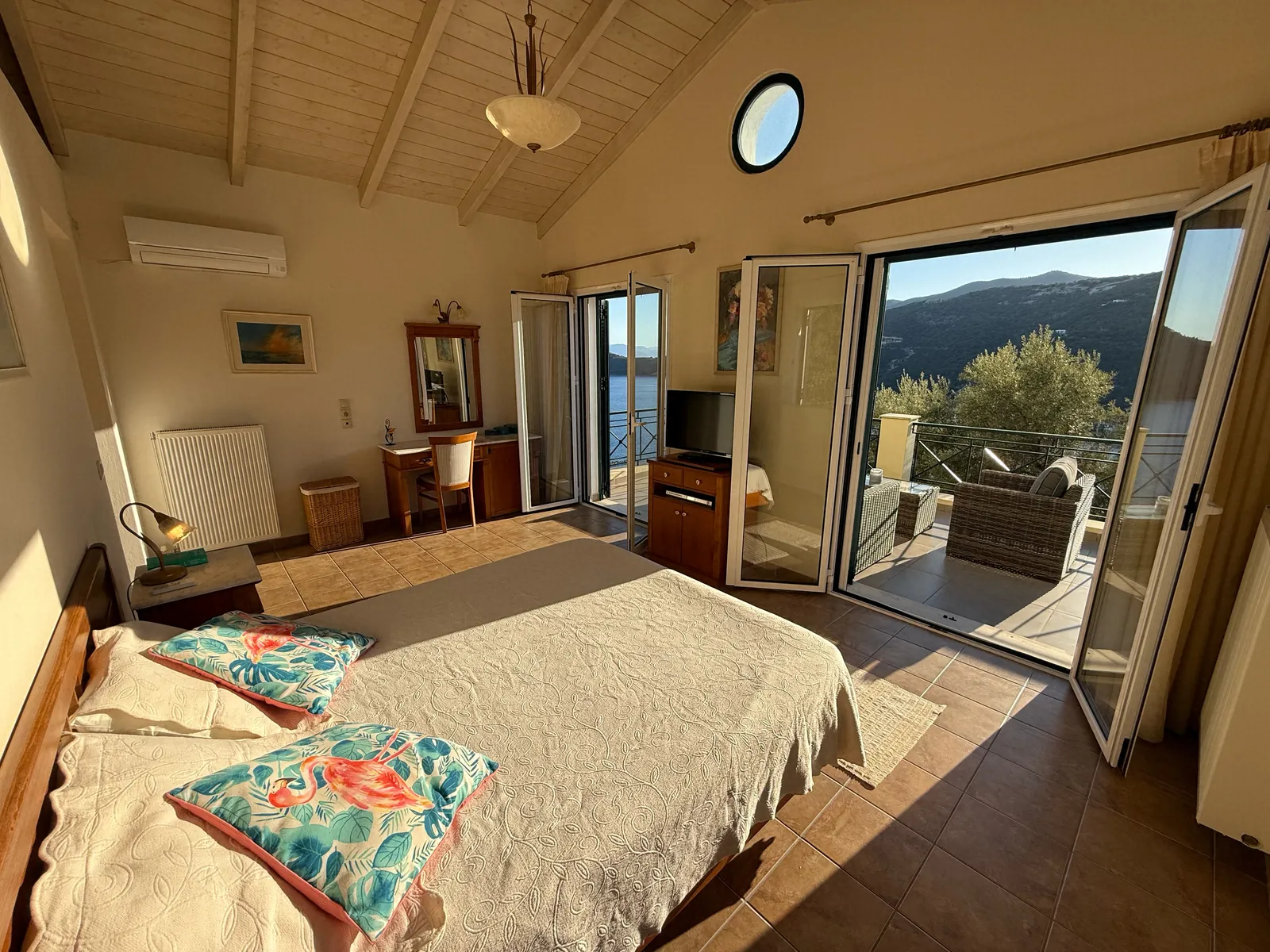 Bedroom 1, opening to the balcony and the sea