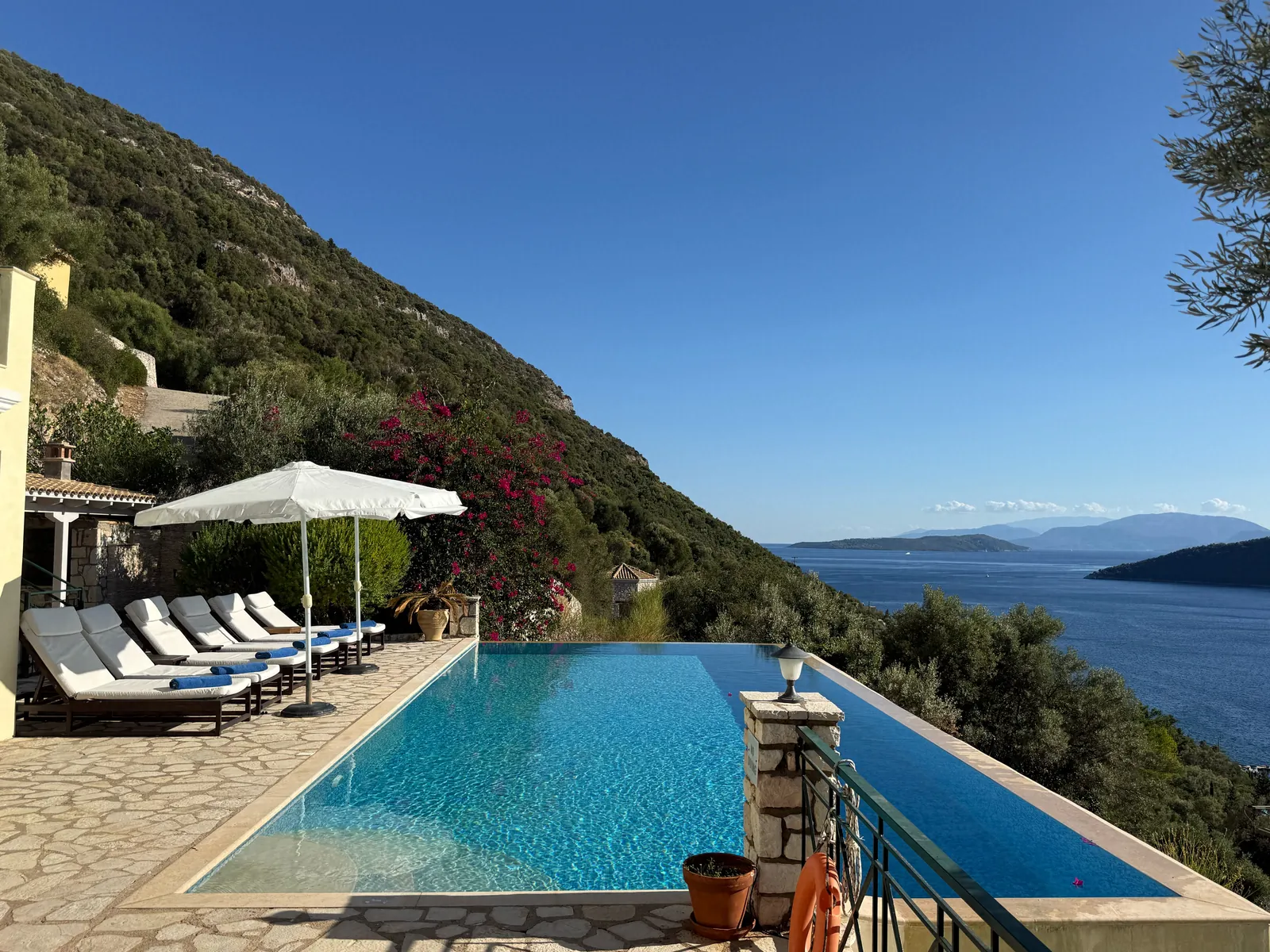 The infinity pool and the green hillside