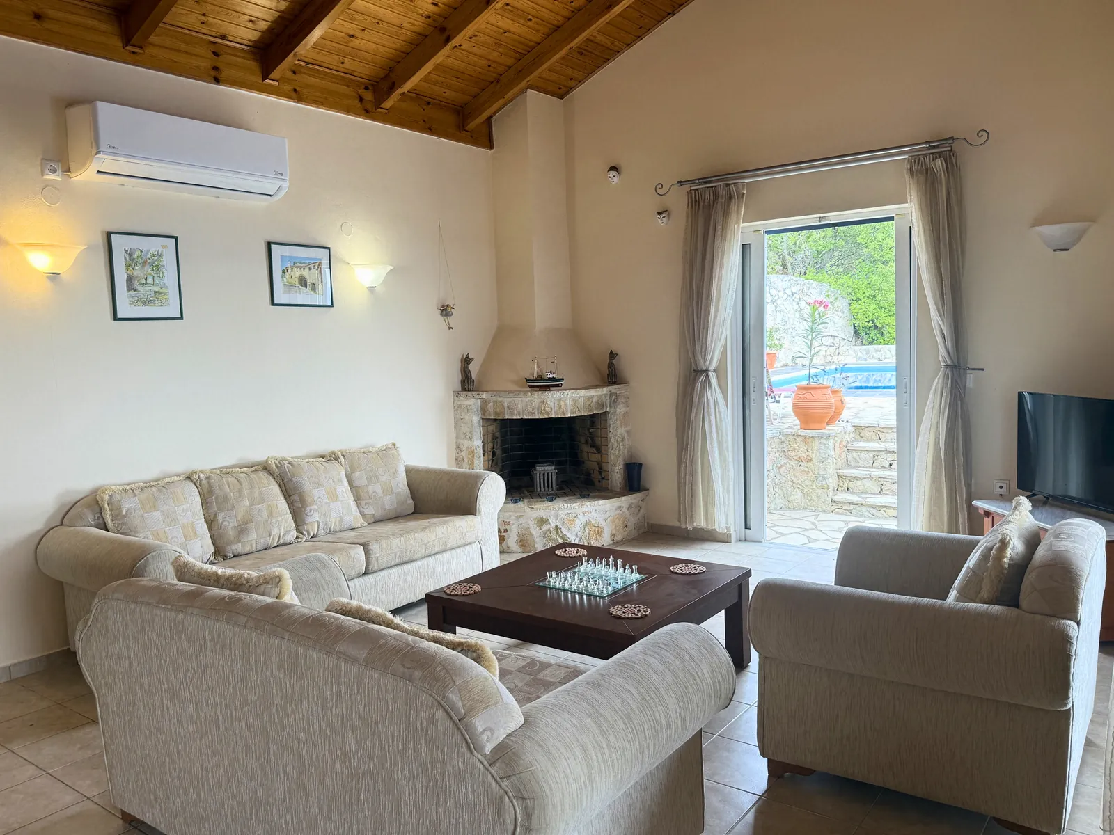 Living room with stone corner fireplace